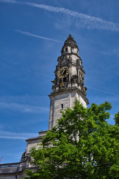 View of the Clock Tower at City Hall from the open top of the Hop on Hop off Bus