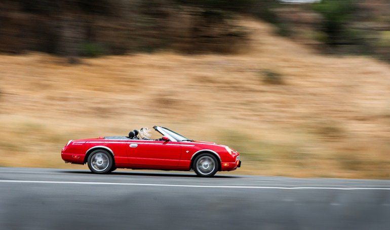 Girl driving Red Car