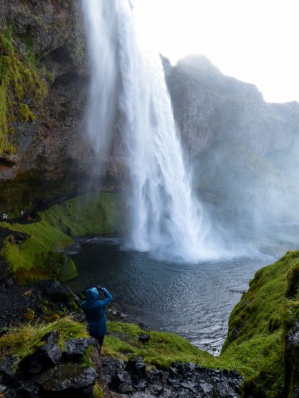 Standing behind Seljalandsfoss