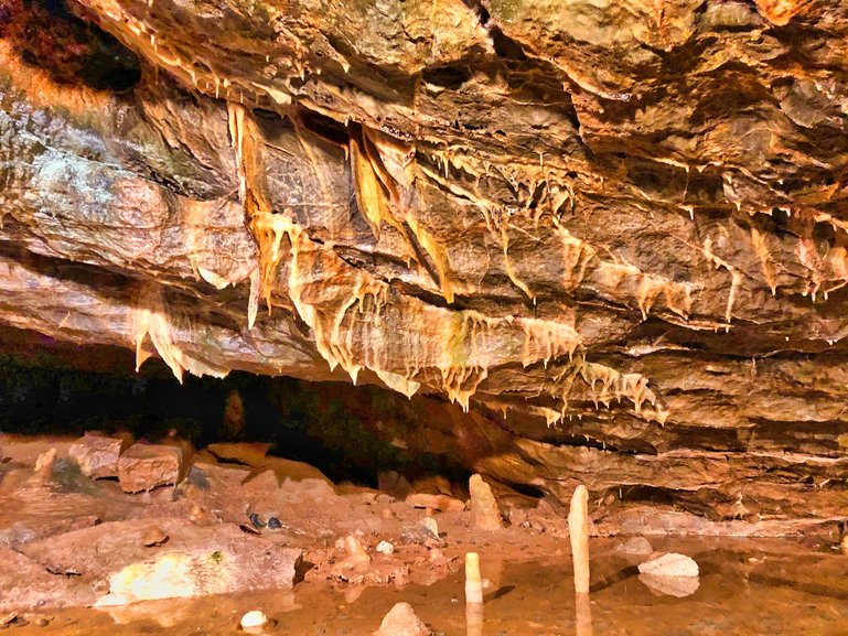 The Stalagtites and Stalagmites in a pool of water. An easy way to remember which is which, is Stalagtites hold tight and Stalagmites might grow up to reach the top.