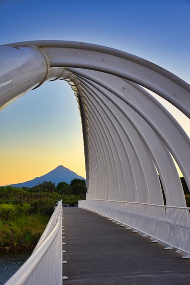 A clear night and Mt. Taranaki is aligned with Te Rewa Rewa Bridge.