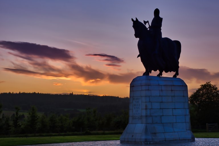 Robert the Bruce at the Battle of Bannockburn site at sunset.