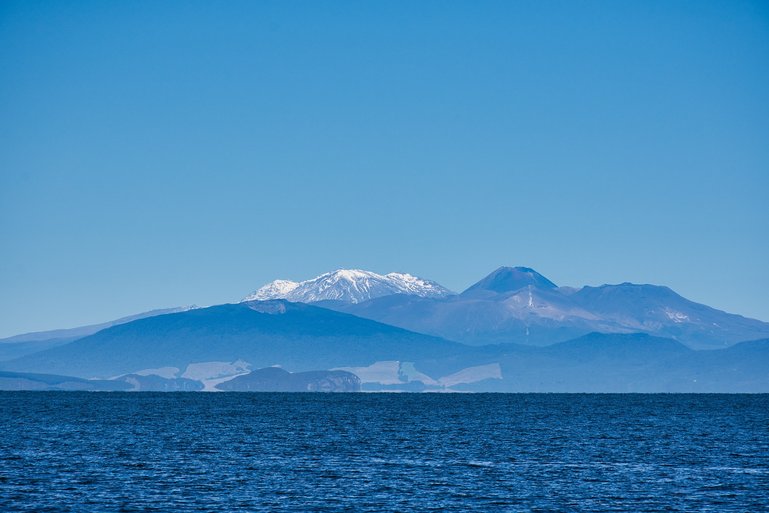 Mountains Ruapehu, Ngauruhoe and Tongariro from the Lake Taupo