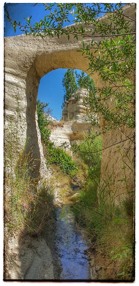 Narrow gully alongside the path