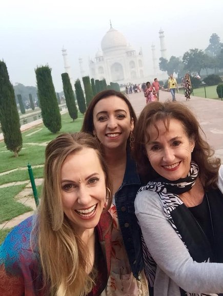 Girls enjoying the Taj Mahal in sunrise 