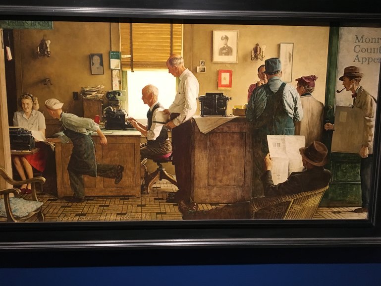 Rockwell's depiction of a 1950s-era newspaper city room