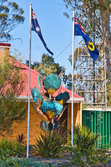 This sculpture is in the garden of the Police Station.