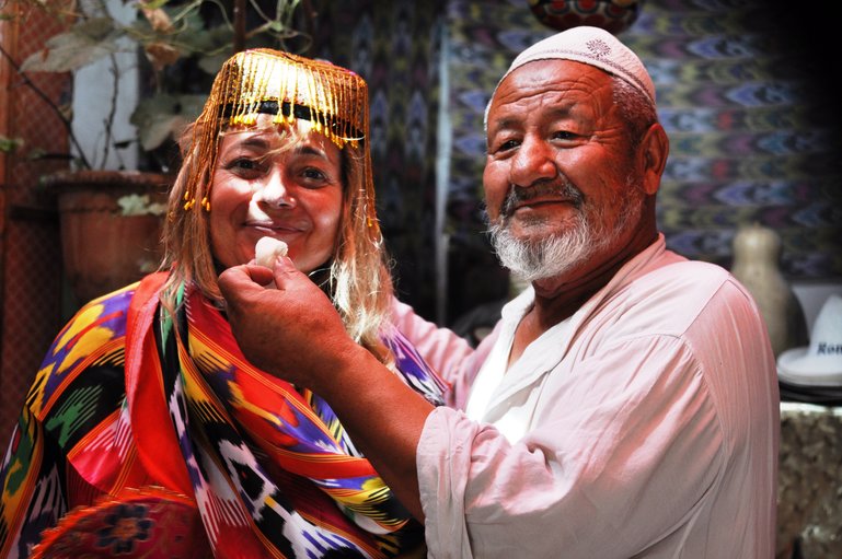 With a shopkeeper in Kashgar, China