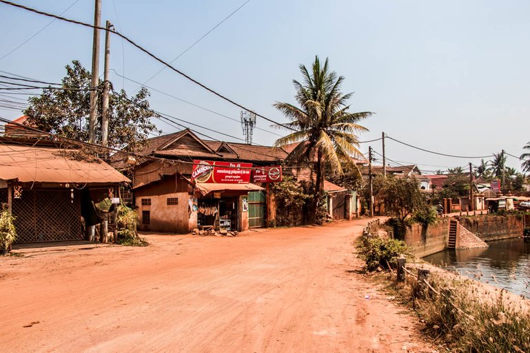 The characteristic red soil on the quieter east bank of the Siem Reap river