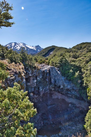 The water at the top of the falls is trickling over the side.