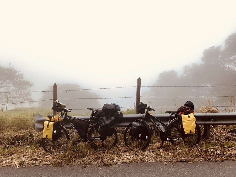 Our bikes pulling us through the foggy mountains of Colombia