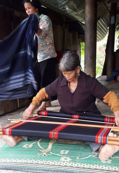 woman weavingtable cloth