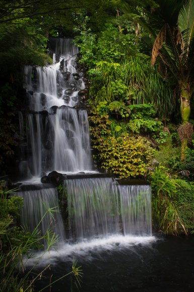 At night, coloured lights give a different perspective to the waterfall.