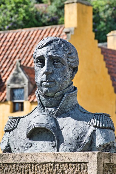 The statue of Admiral Cochrane stands in front of the Palace in the square