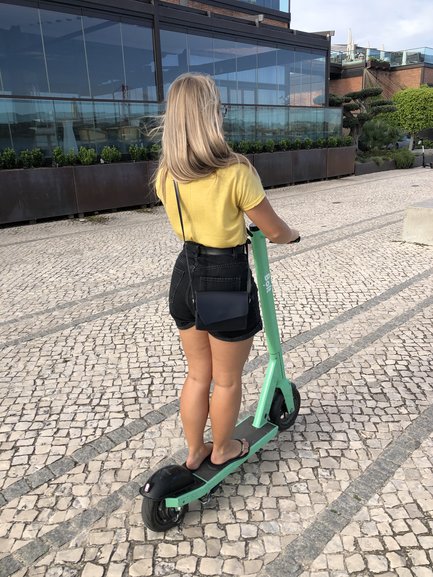 Riding a Bolt scooter along the River Tejo