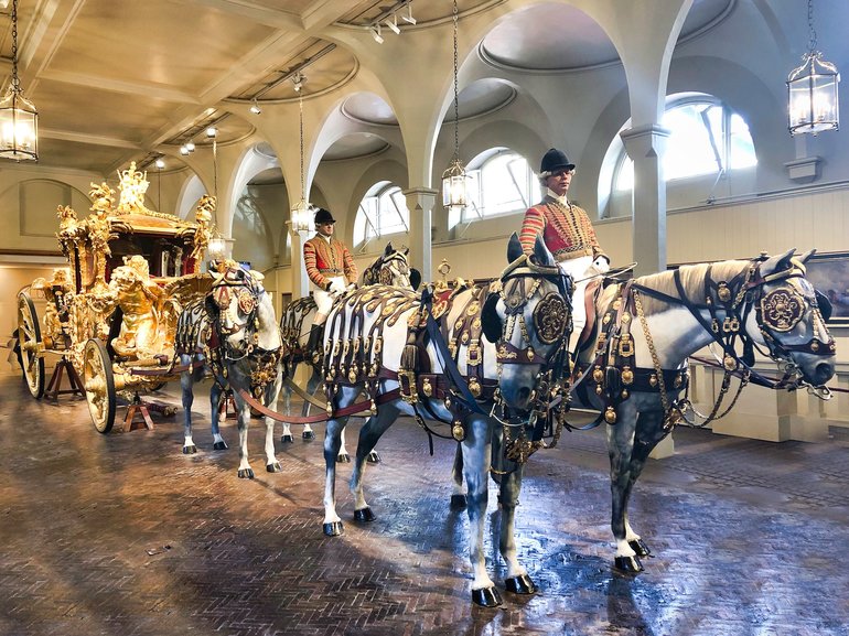 The Gold Coach on display pulled by four horses