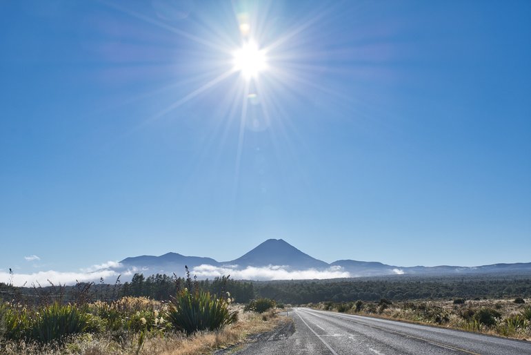 I think that the low morning sun adds to this shot especially with the cloud low on the mountains and the leading line of the road