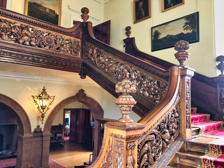 The ornate oak staircase inside Dunster Castle