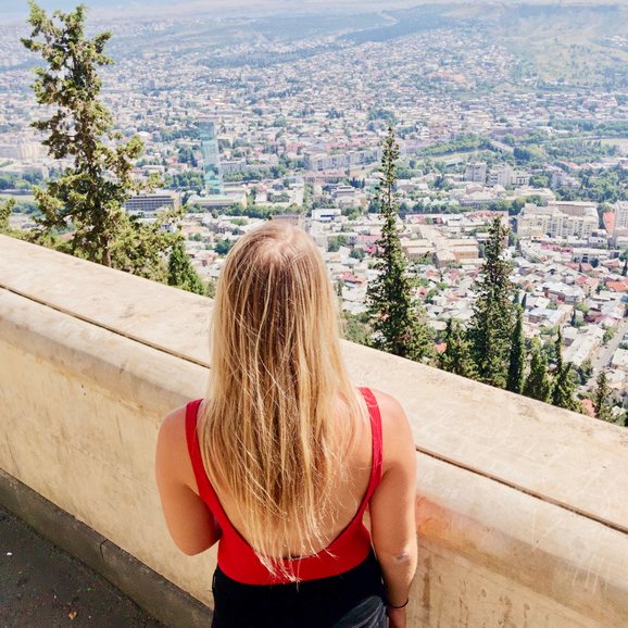 Facilitate Luxury co-founder Reagan overlooking the city from Mtatsminda Park, Tbilisi