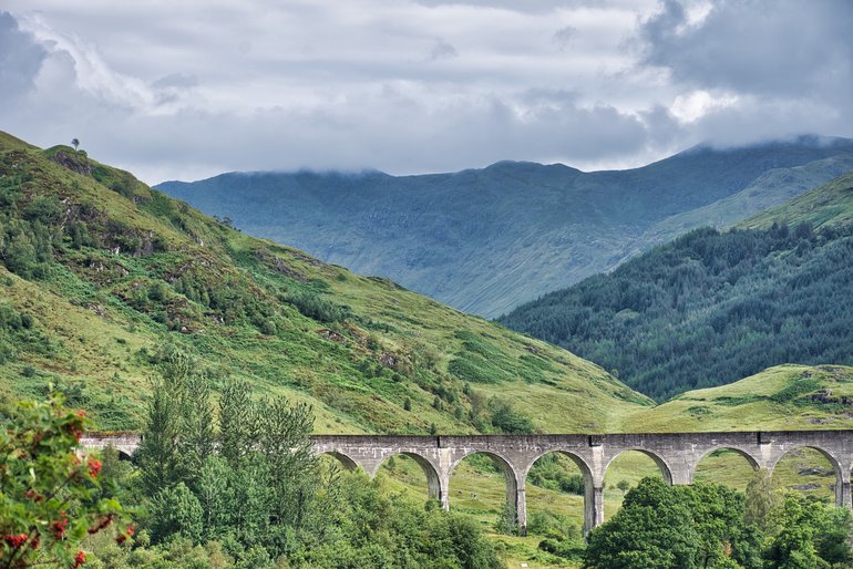 The Glenfinnan Viaduct amongst the Highland mountains