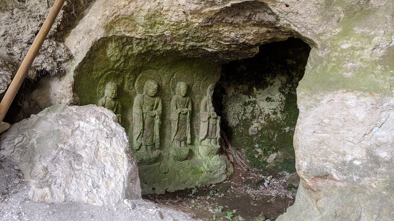 Hidden Buddhist statue carved in stone