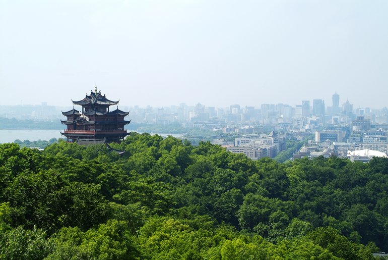 View over West Lake, Hangzhou city centre, and the Chenghuang Pavilion from the Lake and River-view Pavilion
