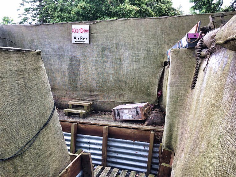 The replica trench on the grounds outside is also part of the guided tour