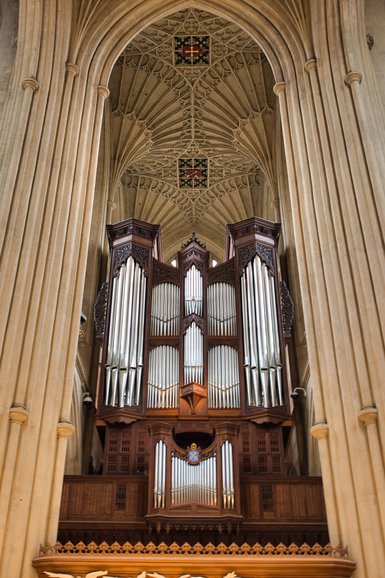 The organ on the wall behind the restorations