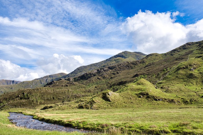 Meandering streams and high mountains greet you in the Highlands