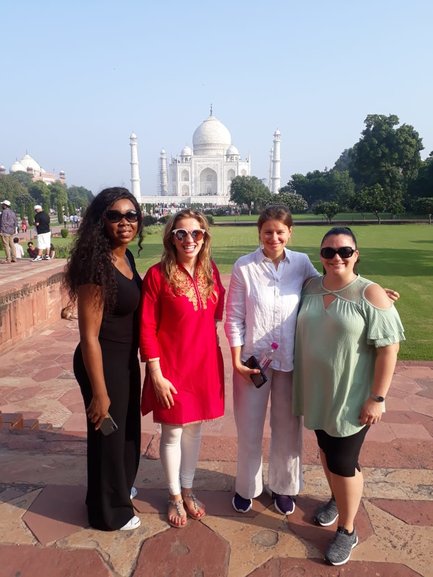 Group of girls in Taj Mahal organised by Aiza tours 