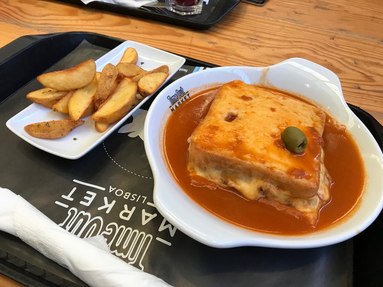 Trying a Francesinha at Time Out Market