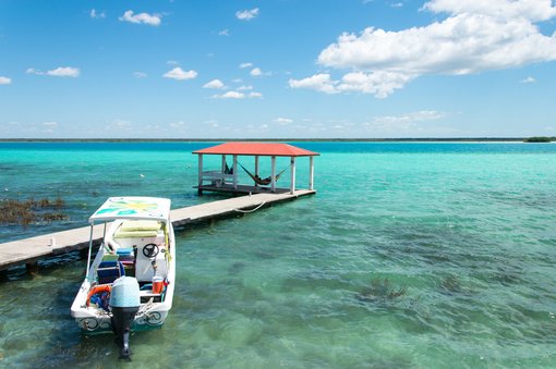 Sunrise Stand-Up Paddleboarding on Lake Bacalar:  Fifty Shades of Blue