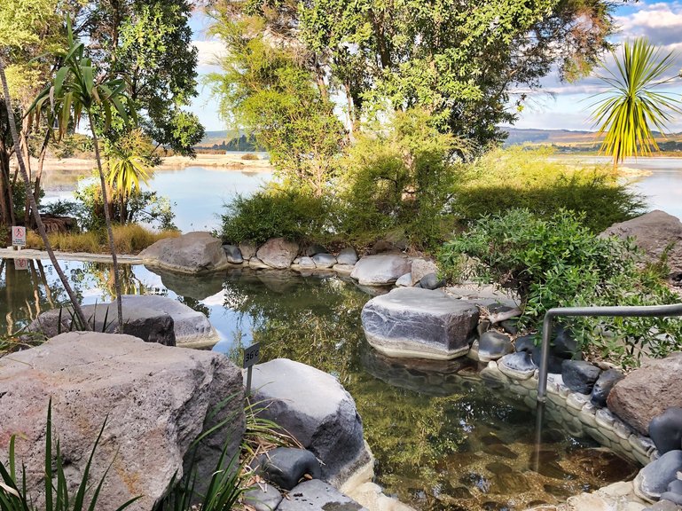 Relax in a hot pool overlooking Sulphur Bay