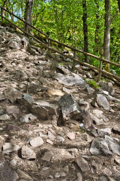 The smooth path gives way to a rocky scramble down