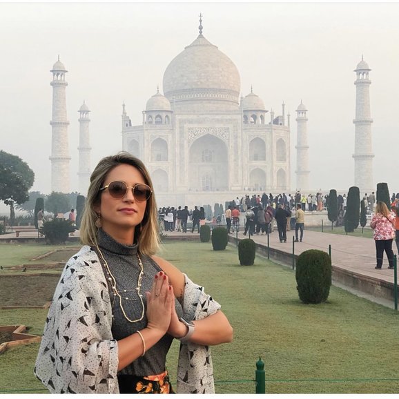 Our guests enjoying the traditional namaskar in the Taj Mahal (namaskar means welcome for a day tour to Taj Mahal )