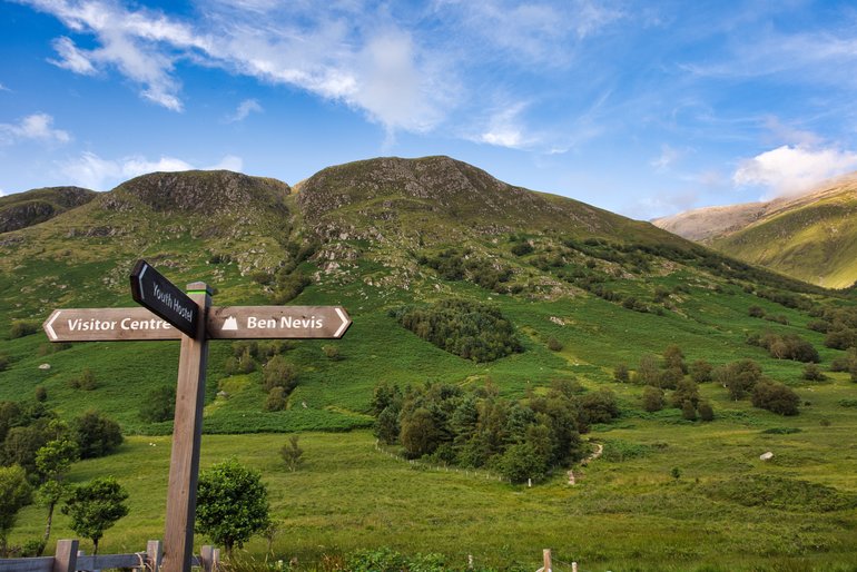 The signposts for the path up Ben Nevis behind it