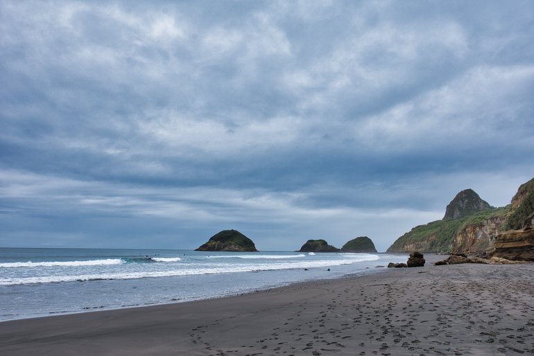 Back Beach with the Sugar Loaf Rocks in the distance and Mt. Puritutu on the right-hand side.