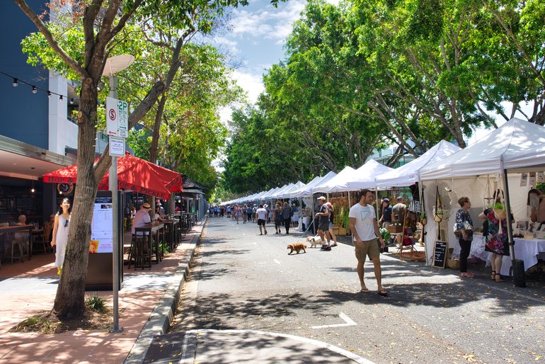 Stalls are along the tree-lined street