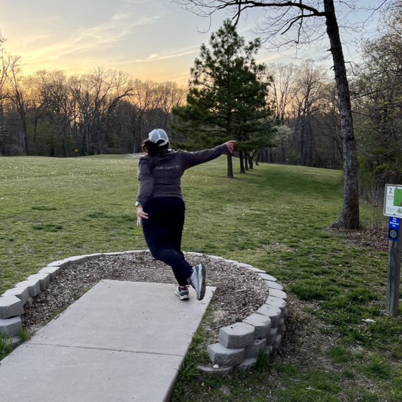 Kim's disc golf tee shot at Branchwood