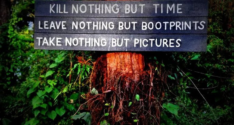 Sign encouraging responsible tourism, Arenal, Costa Rica.