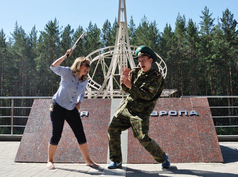 Me ' fighting off' a  guard at the Russian continental divide in the Ural Mountains