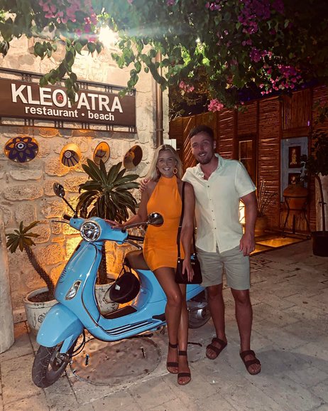 Photograph of Chloe and Connor outside Kelopatra restaurant and beach bar in Side (Photo by SharedBucketList)
