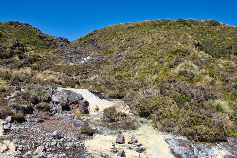 The water is so clear that you can only make out the yellow deposits left behind.