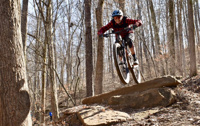 Kate riding Gnaw Bone and a rock feature in Brown County