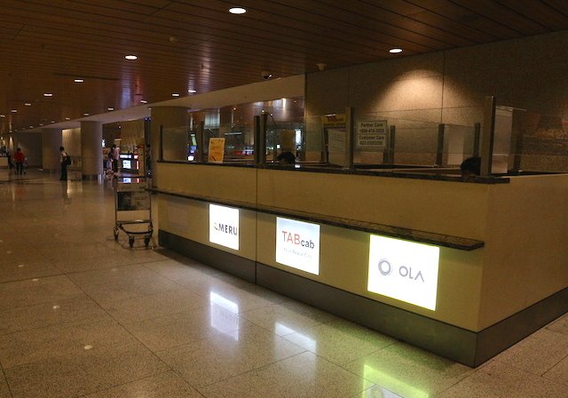 Meru counter in Mumbai airport. Prepaid taxi counters are on the other side to the left.